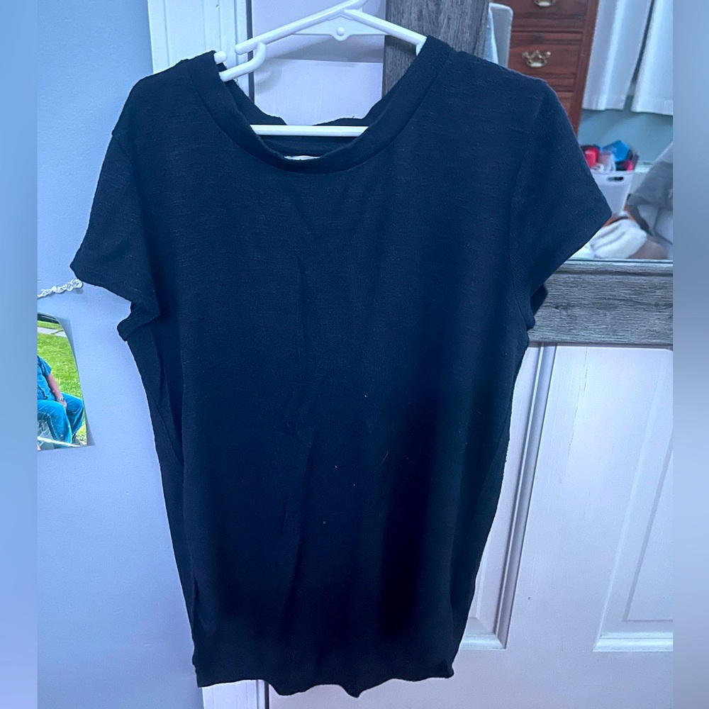 Good quality T, 14 in children but fits a medium adult